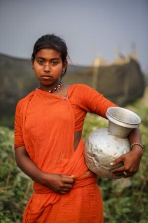 G.M.B. Akash. A young Bede (Beday) girl near a river.