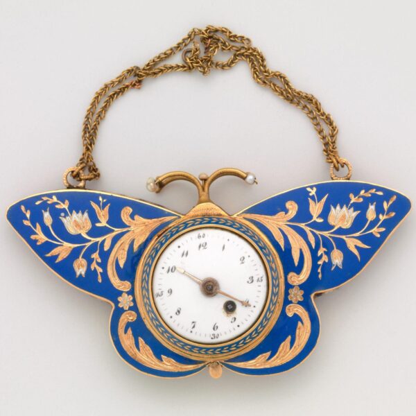 An ornate 19th-century butterfly-shaped pocket watch with blue enamel wings decorated with gold floral designs and a small clock face in the center.