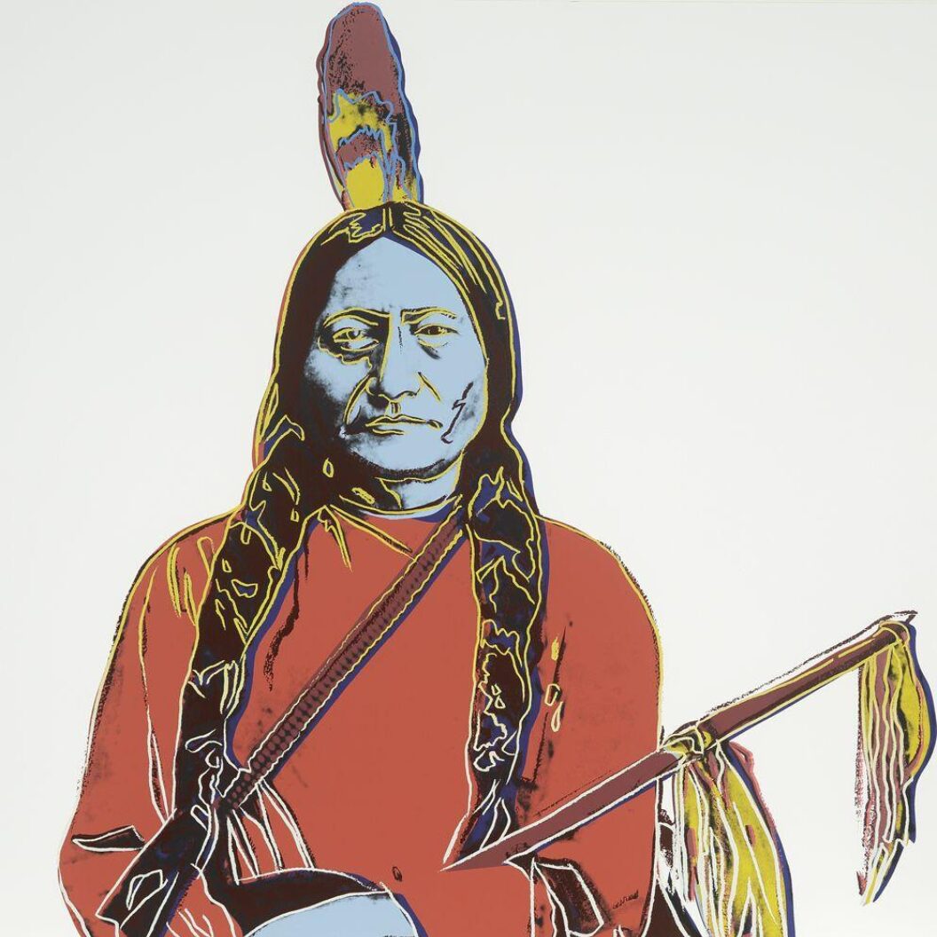 A colorful pop-art portrait of Sitting Bull with bold outlines and bright red, yellow, and blue tones.