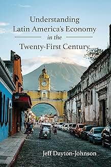 Book cover showing a cobblestone street in a historic Latin American city with colorful buildings on each side. A yellow clock tower with an arch frames a distant mountain under a soft blue sky.