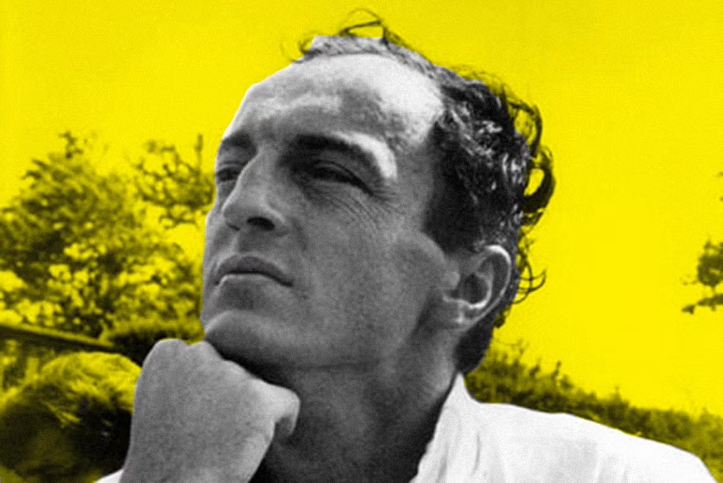 A stylized close-up photo of poet Frank O’Hara resting his chin on his hand, with a bright yellow background behind him.