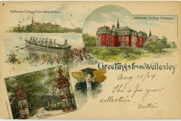 Color illustrated postcard titled “Greetings from Wellesley,” dated Aug. 15, 1904, featuring scenes of Wellesley College: students rowing on Lake Waban, a large red-brick campus building, the campus gates, and a woman in cap and gown.
